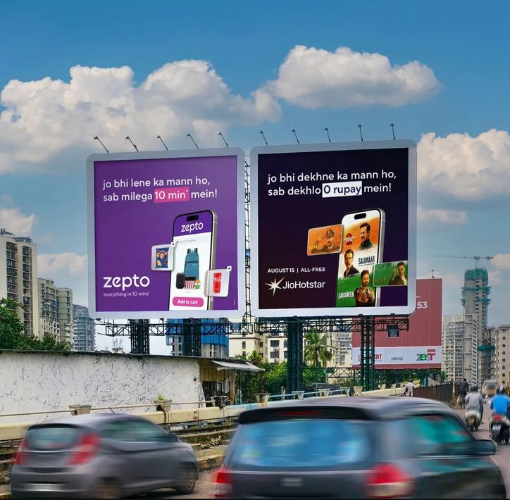 Two Zepto and JioHotstar banter hoardings side by side above a Mumbai flyover